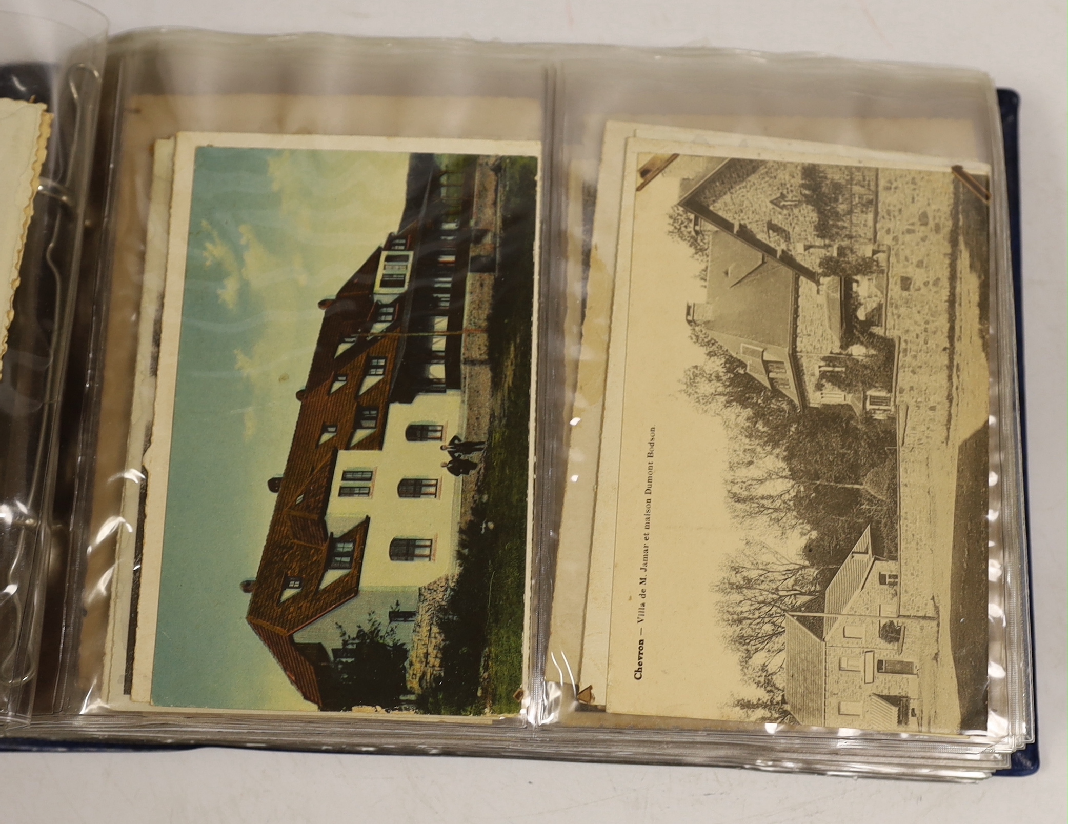 A postcard album, largely continental topography, and eight cards relating to car and motorcycle racing